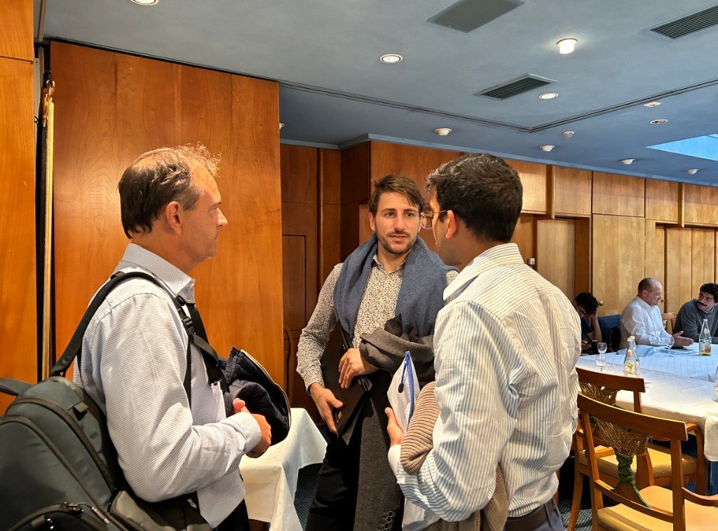 Alphasol team in conversation with partners at a working session